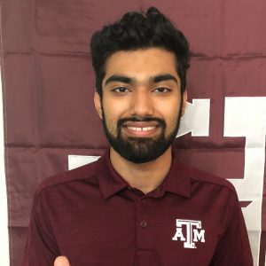 Photo of Pranav smiling with a maroon TAMU polo